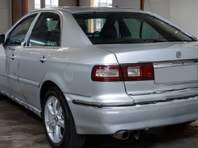 Vehicle wrap installation process with technician applying vinyl wrap